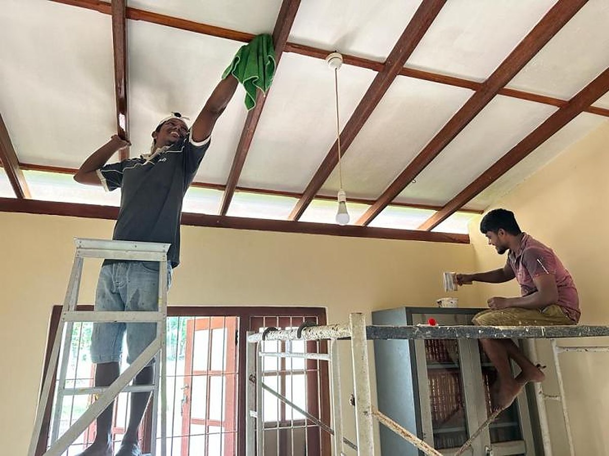 Phoenix team painting the temple ceiling during the renovation