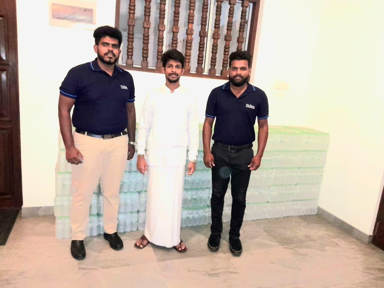 Phoenix team members with drinking water donated to the Sri Dalada Maligawa
