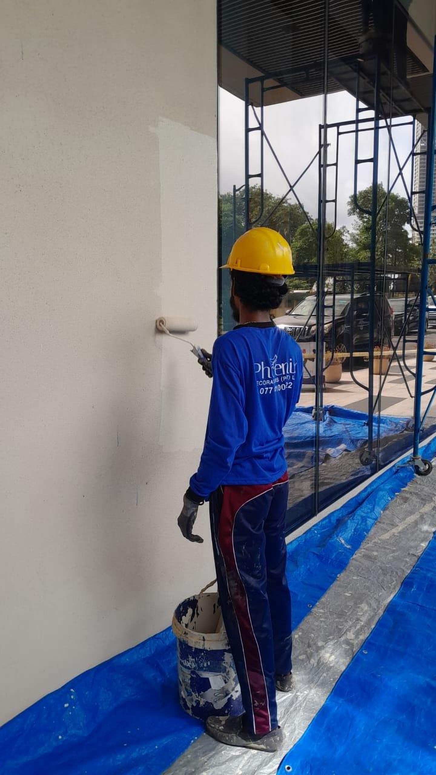 Phoenix painter working on an interior wall