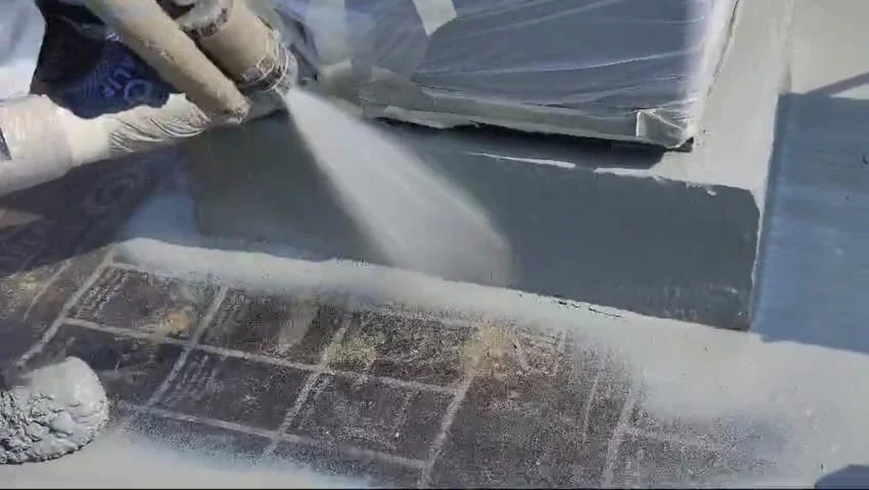 Close-up of a sprayed waterproofing membrane