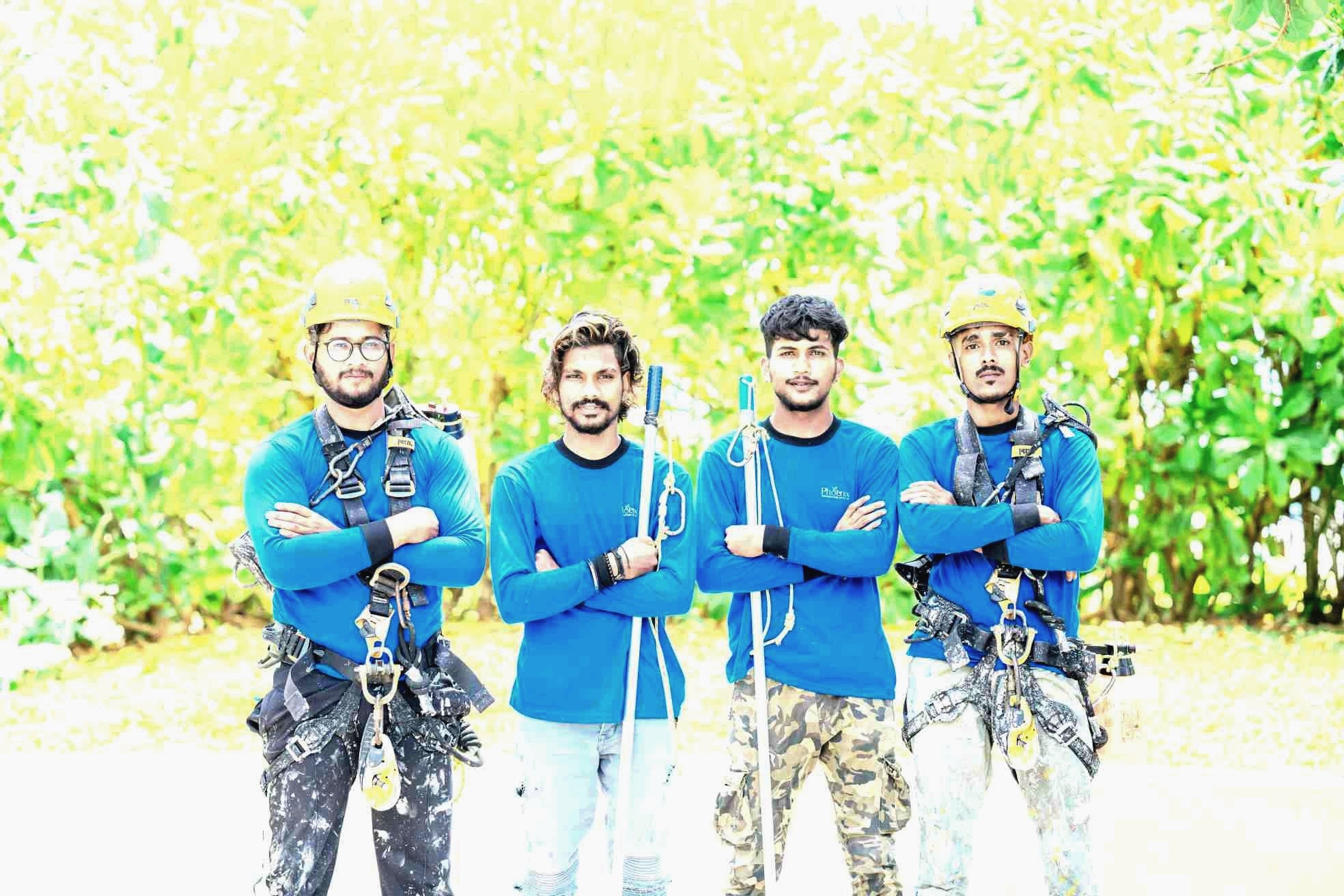 The Phoenix Decorators rope access team in safety harnesses